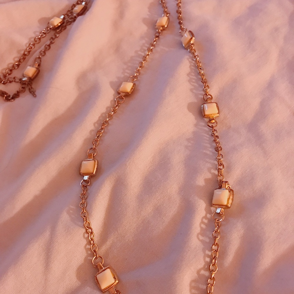white and gold necklace